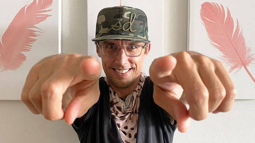 A man pointing towards the camera to indicate the year of you.