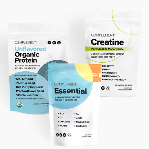 COMPLEMENT® Plant‑Based Essentials Stack by Complement features three supplement packages—Unflavored Organic Protein, Essential Multivitamin, and Creatine—in modern, clean bags with white backgrounds and colorful accents showing key benefits.
