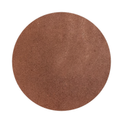 A close-up of a round, brown, textured surface, resembling a powder or makeup compact.