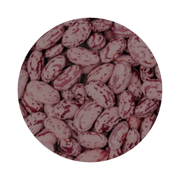 A circular image featuring a pile of speckled kidney beans with white and maroon patterns.