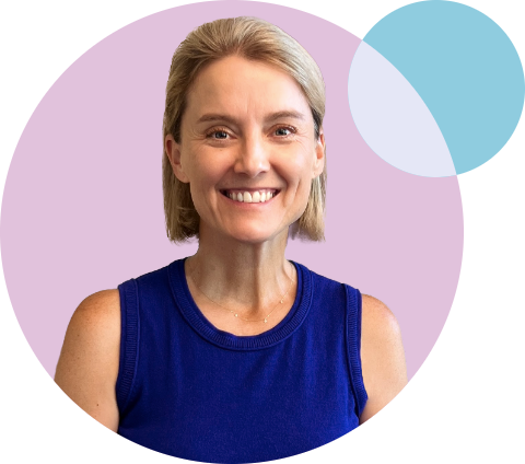 A person with short blond hair smiles warmly, wearing a sleeveless blue top. The background features overlapping purple and blue circles.