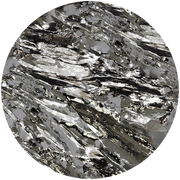 Close-up of a shiny, metallic mineral with a layered, flaky texture. The mineral has reflective silvery and dark gray surfaces, showcasing its intricate crystalline structure.