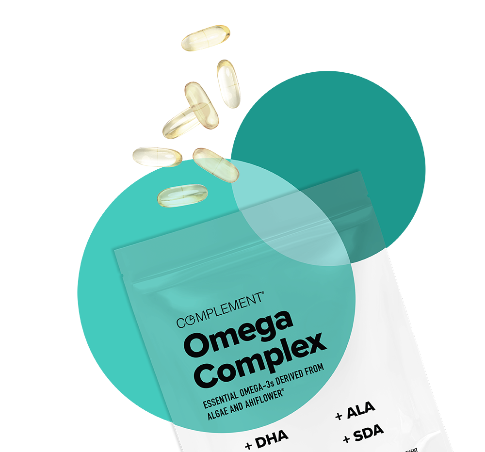 A packet labeled Complement Omega Complex with several clear capsules spilling out. The packaging notes omega-3s derived from algae and Ahiflower, featuring components like DHA, ALA, and SDA. The background is a mix of teal and white.