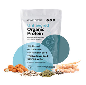 A bag of Complement Unflavored Organic Protein is displayed with ingredients in front: almonds, chia and pumpkin seeds, sunflower seeds, and yellow peas. The bag details the percentage of each ingredient.