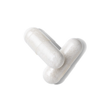 Two clear capsules filled with a white powder are positioned diagonally on a plain white background.