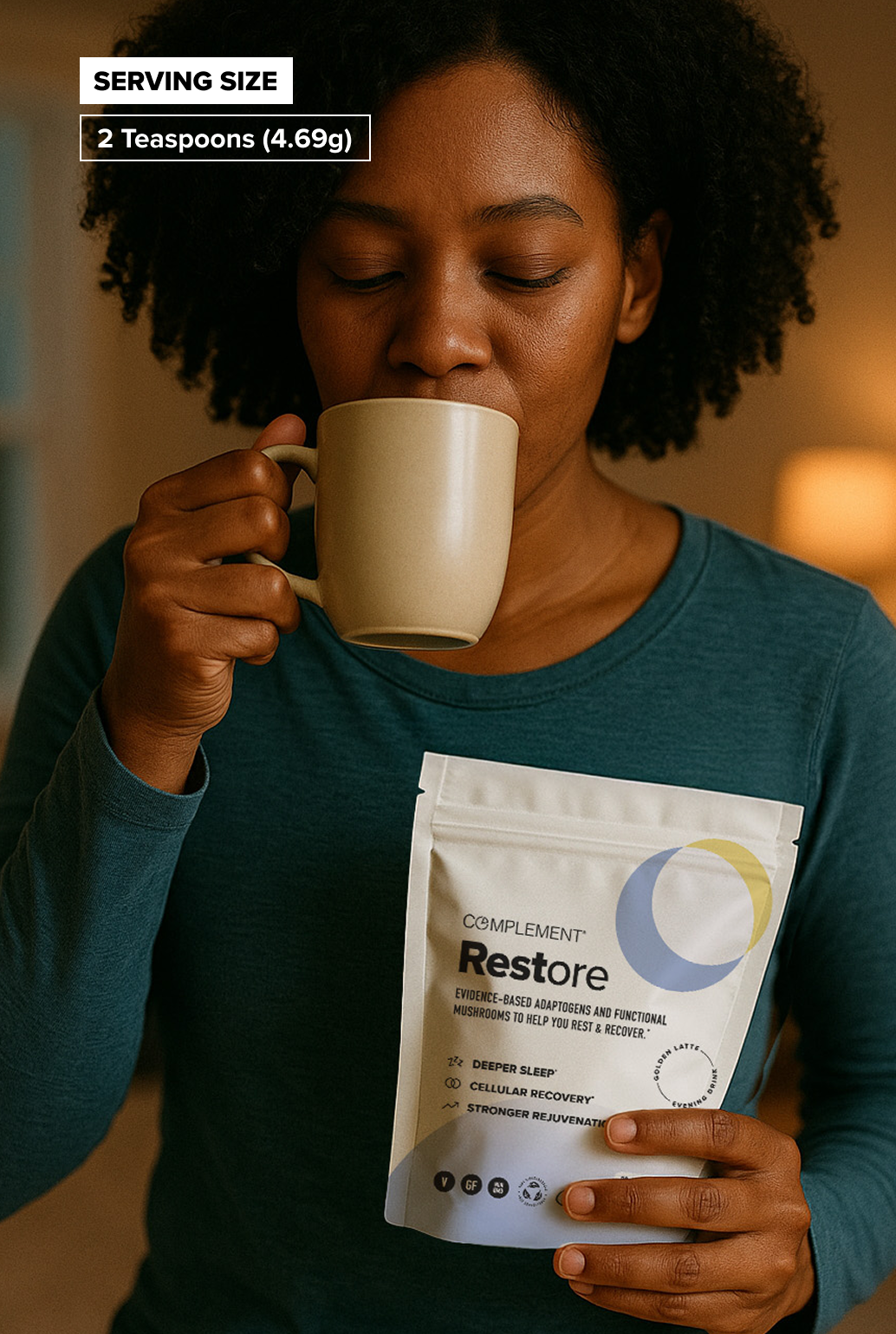 A woman in a teal shirt drinks from a beige mug while holding a bag labeled Complement Restore. A label above reads, Serving Size: 2 Teaspoons (4.69g).