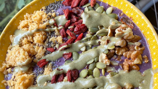 A smoothie bowl topped with goji berries, walnuts and more.