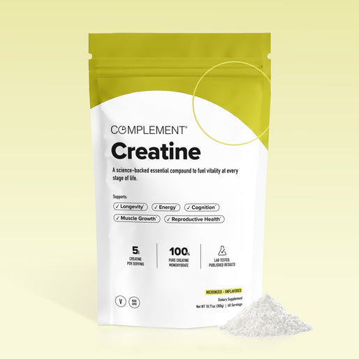 A white and yellow pouch labeled “Complement Creatine” stands upright, with white creatine powder spilled beside it. Text highlights benefits like energy, muscle growth, and cognition. The background is a light gradient.
