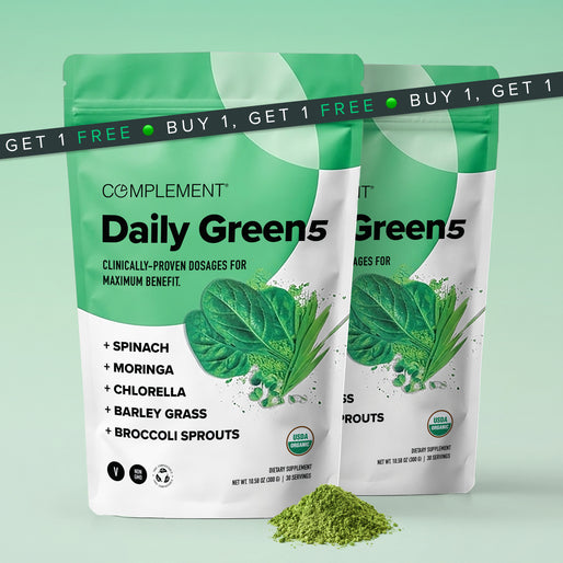 Two green and white bags of Complement Daily Green5 powder with spinach and powder images, labeled as containing spinach, moringa, chlorella, barley grass, and broccoli sprouts. “Buy 1, Get 1 Free” banner at top.