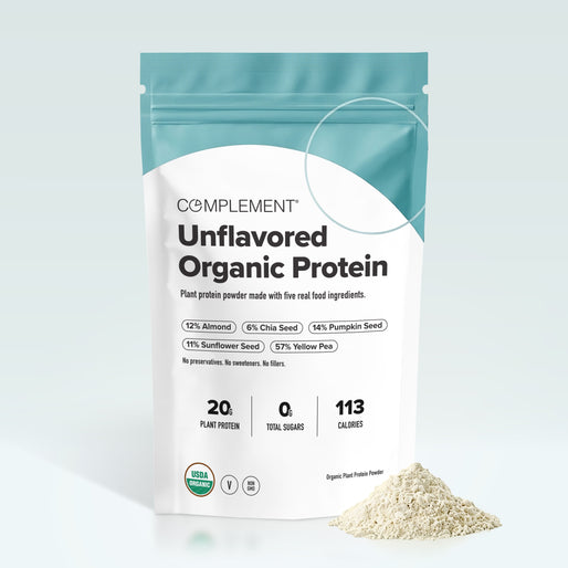 A bag of Complement Unflavored Organic Protein powder stands upright, displaying nutrition facts and ingredients; a small pile of the powder is shown in front on a white background.