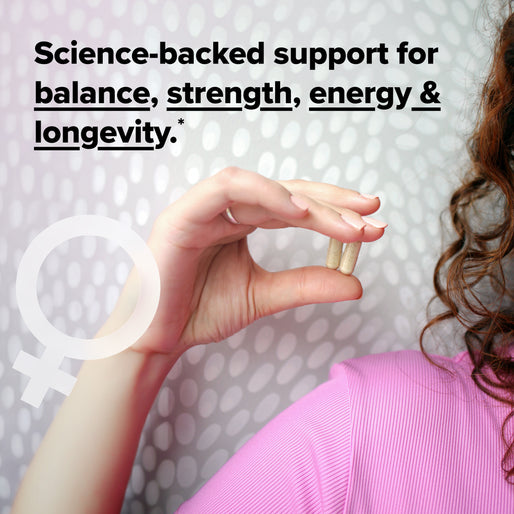 A person in a pink shirt holds two capsules. Text reads: Science-backed support for balance, strength, energy & longevity. A white female symbol is overlaid on a polka-dot background.