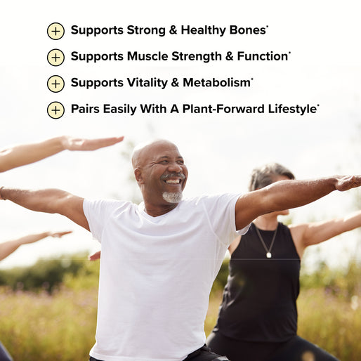 A smiling man leads an outdoor group yoga session. Four health benefits are listed, including bone support and muscle strength, on a clear, sunny day.