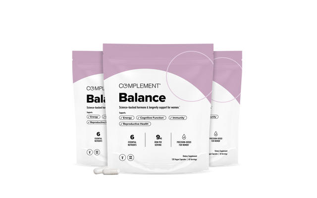 Three white and lavender Balance supplement bags labeled for womens health, with capsules placed in front, highlighting benefits like energy, immunity, reproductive health, and clean ingredients. Minimalist, clean background.