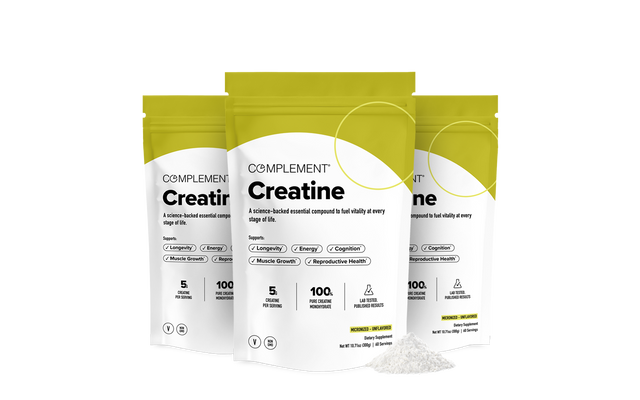 Three yellow and white pouches labeled Complement Creatine are shown, with a small pile of white creatine powder in front. The packaging lists benefits like energy, cognition, and muscle growth.
