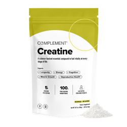 A white and yellow pouch labeled Complement Creatine sits upright with some white powder spilled next to it. The packaging mentions benefits like energy, longevity, cognition, muscle growth, and reproductive health.