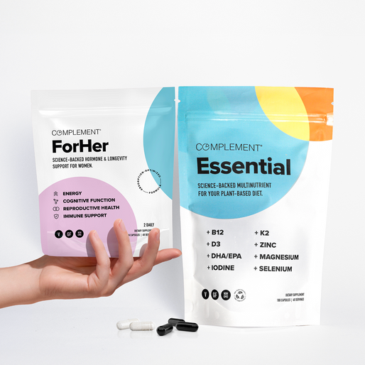 A hand holds a white pouch labeled 