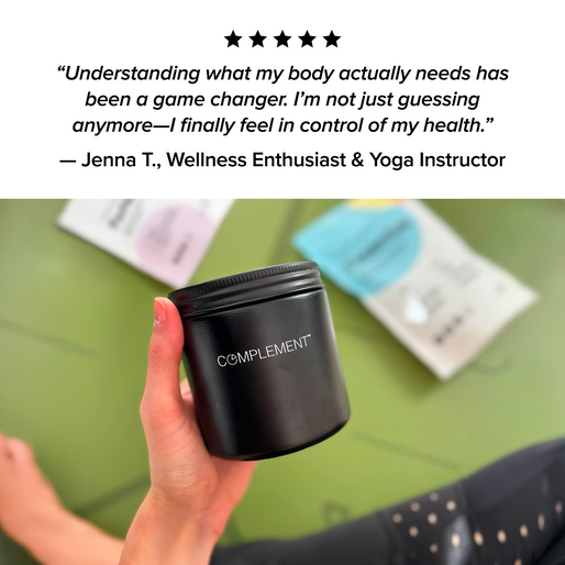 A hand holds a black jar labeled “COMPLEMENT® ForHer Essential System (Plant Based)” by Complement above a green yoga mat, with blurred wellness product packages and a person’s knee in the background. A testimonial quote is seen above the image.