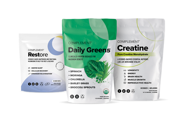 Three supplement pouches labeled Restore, Daily Greens 5, and Creatine stand side by side. Each package displays its product name, key ingredients, and health benefits with colorful, modern designs.