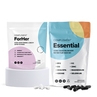 Two Complement supplement packages—COMPLEMENT® ForHer Essential System for hormonal balance (pink/blue), and Essential for daily nutrients (orange/blue)—are displayed with capsules on white podiums.