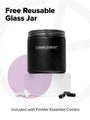 A black reusable glass jar with the Complement logo is on a white platform, surrounded by capsules. Abstract purple and gray shapes fill the background. Text reads Free Reusable Glass Jar, emphasizing its inclusion with the ForHer Essential System Multinutrient for your health solution.