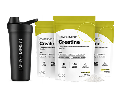 Three yellow and white Complement Creatine supplement bags with powder beside them, next to a black Complement shaker bottle with a lid, all on a white background.