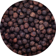 Close-up of a pile of black peppercorns. The small, round, dark brown spices are tightly clustered, showcasing their rough, textured surfaces.