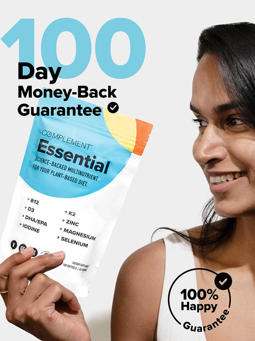 A person smiles while holding a colorful package of Complement Essential multivitamins. Text on the image reads 100 Day Money-Back Guarantee and 100% Happy Guarantee. The package mentions vitamins and minerals for a plant-based diet.