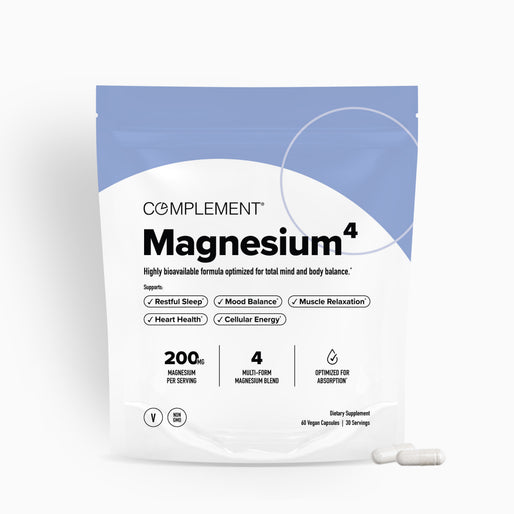 A white resealable pouch labeled “Complement Magnesium⁴” with key benefits like restful sleep, mood balance, muscle relaxation, heart health, and cellular energy listed. Two white capsules are shown beside the pouch.