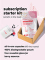 Image of a subscription starter kit for essential science-backed vitamins. Includes a resealable bag, a glass jar, and capsules, shown in a cardboard box. Text details the contents: a 60-day supply, biodegradable pouch, and berry essence.