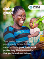 A smiling woman holds a potted plant while carrying a child wrapped in a blue cloth. Text on the image reads: doing good. Your order supports women plant seeds for our future... Logo at the top right says WEA Womens Earth Alliance.