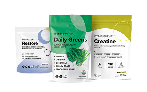 Three Complement brand supplement packages: Restore, Daily Greens 5, and Creatine, with distinct colored designs and text detailing their benefits and ingredients.