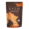 A blurry image of a brown package labeled RYZE. The packaging features orange and yellow leaf designs.