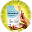A person holds a packet labeled Essential and a black capsule against a bright, green, sunburst-like background suggesting health and vitality.