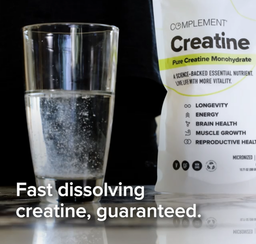 A glass of water with creatine dissolving next to a bag labeled Creatine and text overlay: Fast dissolving creatine, guaranteed.