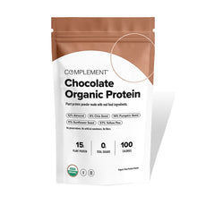 A brown and white package labeled Complement Chocolate Organic Protein, showing plant-based protein content, ingredients percentages, 15g protein, 0g sugars, 100 calories, USDA organic seal, and no artificial sweeteners.
