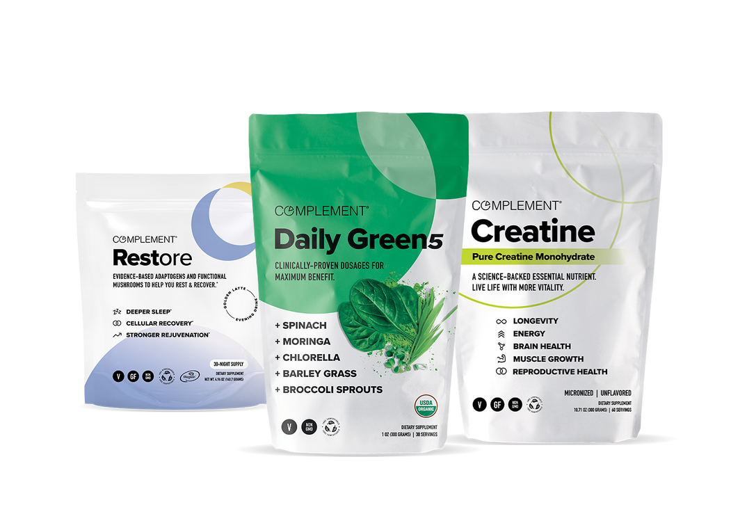 Three Complement supplement pouches: Restore, Daily Green 5, and Creatine, each with colorful, modern designs and labeled benefits on a white background.