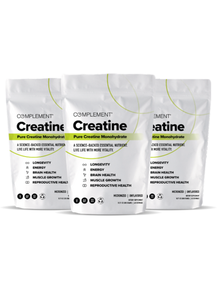 Three white bags of Complement Creatine supplement stand side by side. The packaging highlights benefits such as longevity, energy, brain health, muscle growth, and reproductive health.