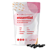 A pouch labeled Essential with multinutrient details like B12, D3, DHA/EPA, K2, zinc, magnesium, iodine, and selenium for a plant-rich diet. Several black capsules are displayed in front of the package.
