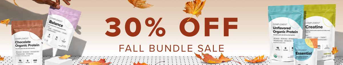 Hands hold organic protein powder pouches near 30% OFF FALL BUNDLE SALE text. Autumn leaves fall around colorful supplement bags on a white surface.