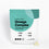 A teal and white pouch labeled Complement Omega Complex with text listing DHA, EPA, ALA, and SDA. The package states it contains vegan capsules. Two yellowish capsules are placed beside the pouch.
