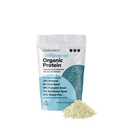A bag of Complement Unflavored Organic Protein powder. The package highlights plant-based ingredients: 12% almond, 6% chia seed, 14% pumpkin seed, 11% sunflower seed, and 57% yellow pea. The powder is displayed in a mound in front of the bag.