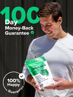 Vegan co-founder Matt Tullman holding Complement Daily Greens powder next to 100 day guarantee graphic